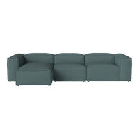 Teal sectional sofa with a sleek, minimalist design and soft, textured fabric. Perfect for modern living spaces.