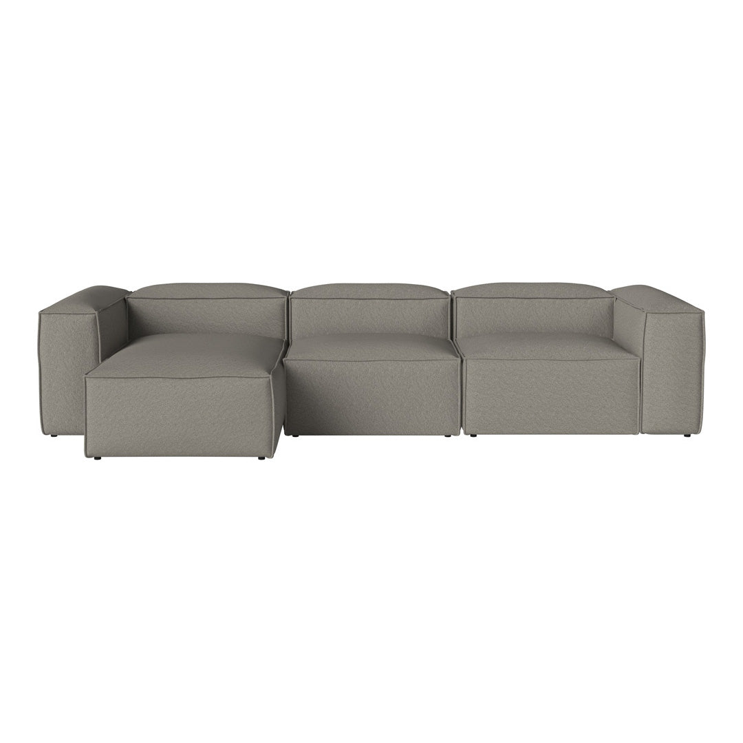 Modern gray sectional sofa with a clean, minimalist design and smooth fabric texture. Ideal for contemporary interiors.