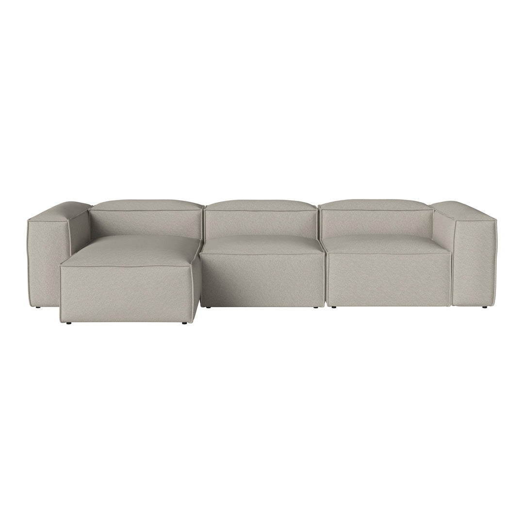 Neutral beige sectional sofa with a minimalist design and smooth, sleek lines for a modern aesthetic.