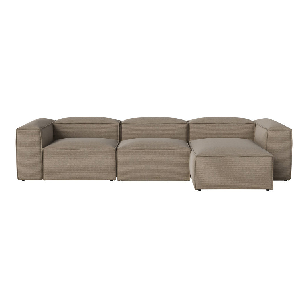 Beige sectional sofa with a smooth, textured fabric and clean lines, featuring a minimalist design.