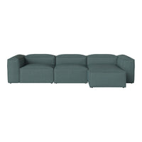 Teal sectional sofa with a clean, modern design and smooth, solid fabric upholstery. Perfect for contemporary spaces.