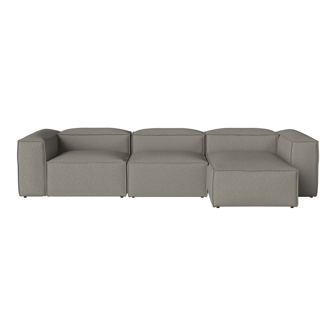 "Modern modular sofa in soft gray fabric with minimalist design and clean lines."
