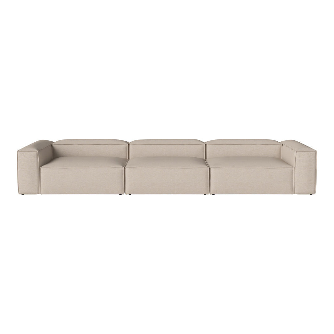 Beige modular sofa with a sleek, minimalist design and smooth texture. Ideal for modern living spaces.