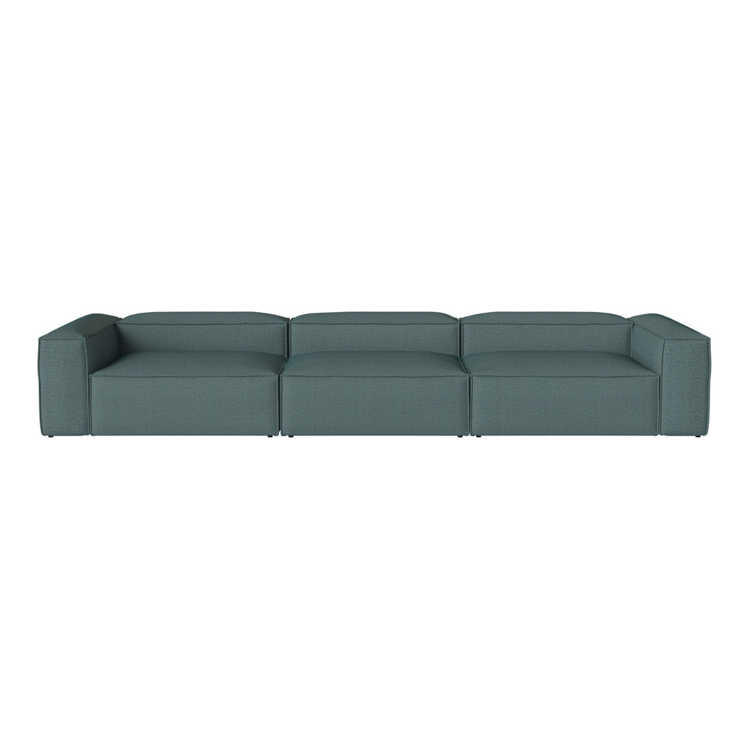 Teal modular sofa with a smooth, solid fabric finish, featuring a minimalist design and clean lines.