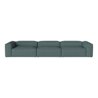 Teal modular sofa with a smooth, solid fabric finish, featuring a minimalist design and clean lines.