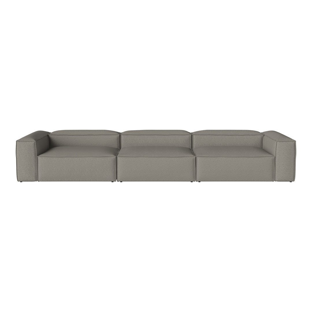 Modern grey sectional sofa with a sleek, minimalist design and smooth upholstery, perfect for any living space.