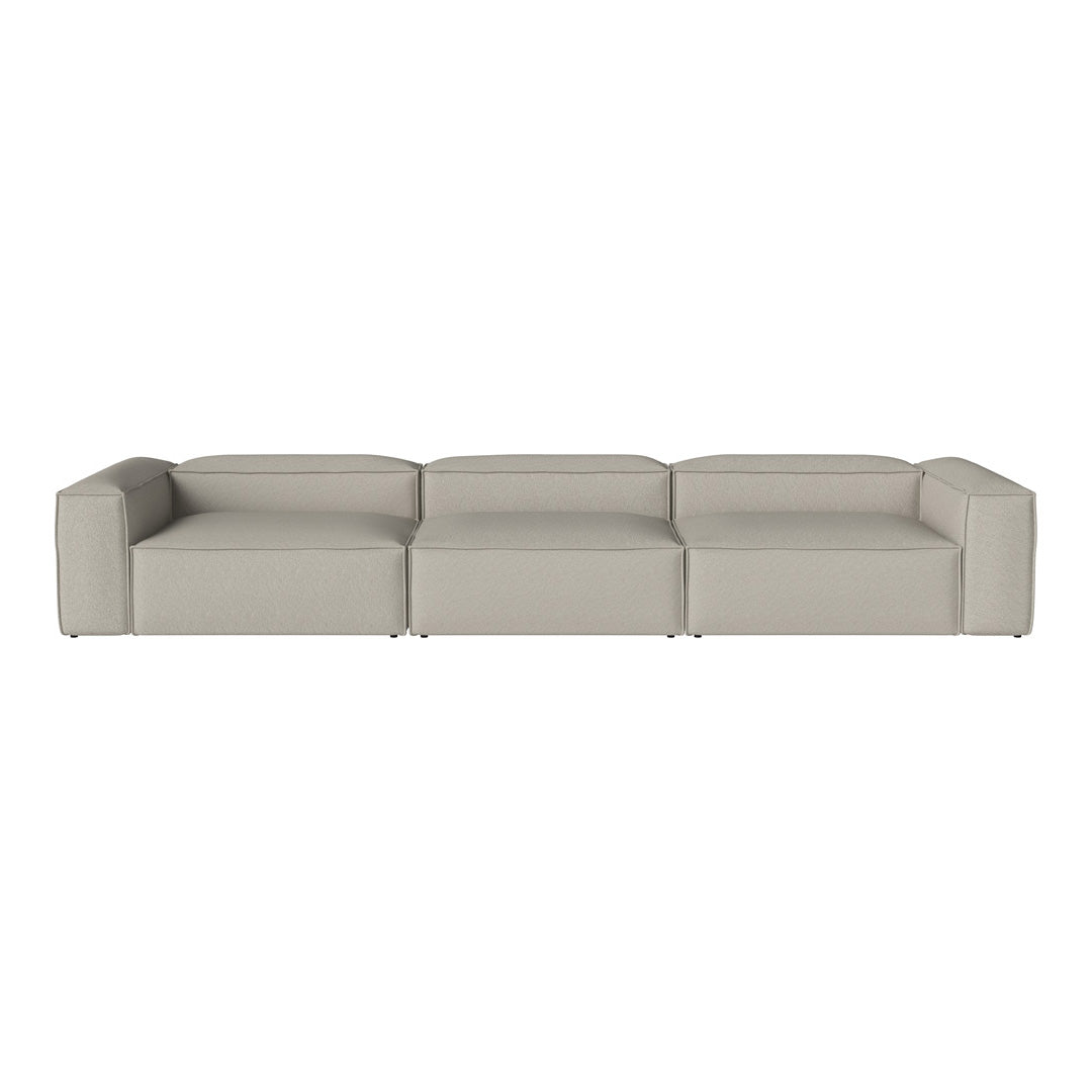 Minimalist beige sectional sofa with sleek lines and smooth texture, perfect for modern decor.