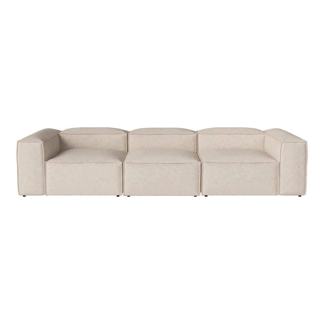 Beige modular sofa with a smooth, textured fabric, featuring a minimalist design and sleek lines. Perfect for modern decor.