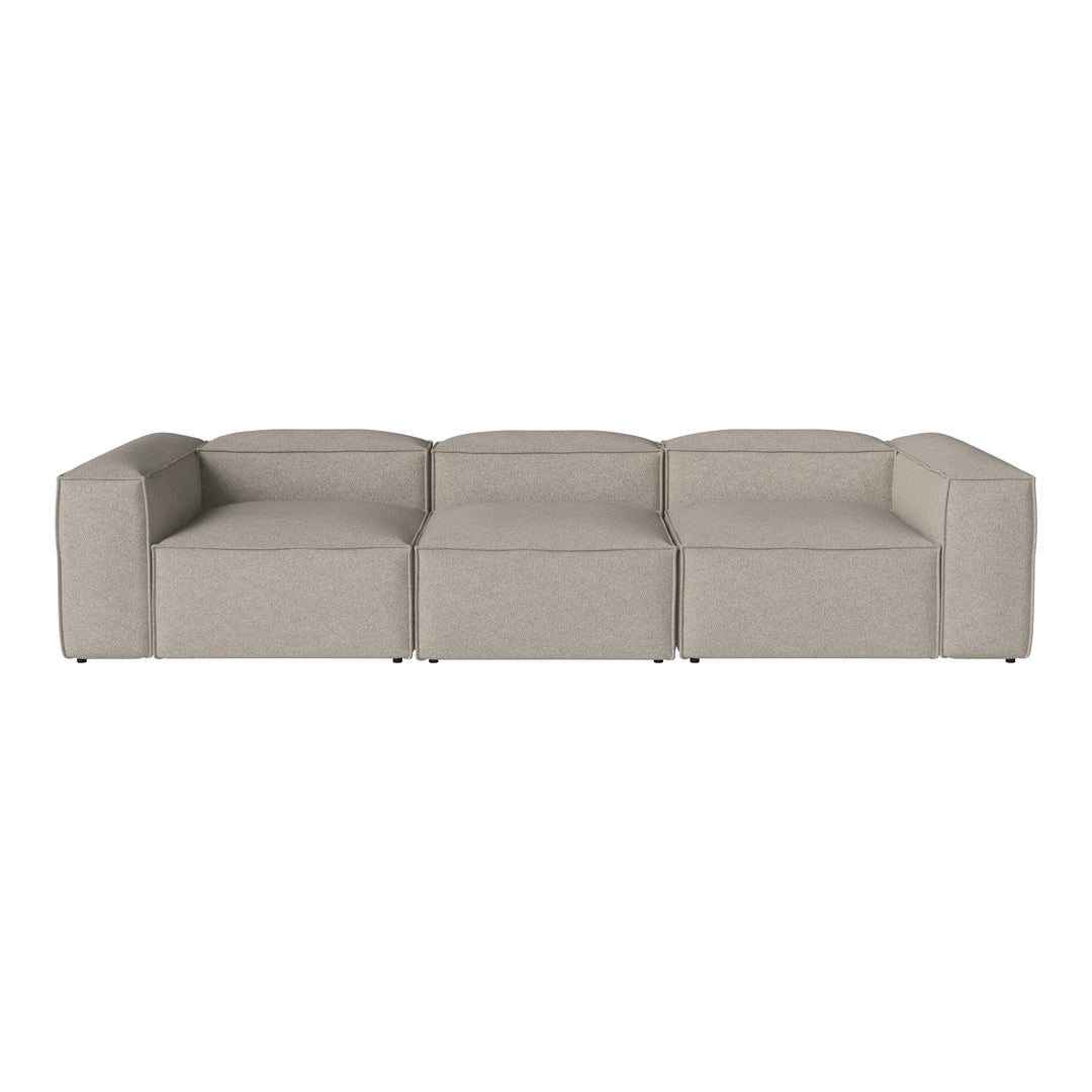 Beige modular sofa with a smooth, solid fabric pattern, featuring clean lines and a contemporary design.
