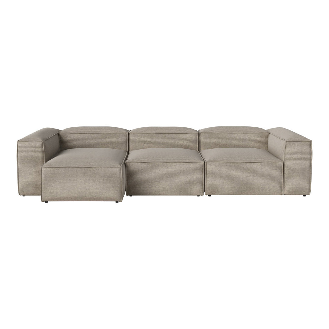 Beige modular sofa with a minimalist design and clean lines, featuring a textured fabric pattern.