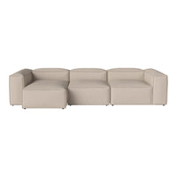Beige modular sofa with a minimalist design and clean lines, featuring a smooth fabric texture.
