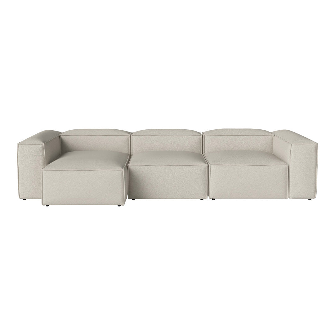 Beige modular sofa with a minimalist design and smooth, solid fabric pattern. Ideal for modern living spaces.
