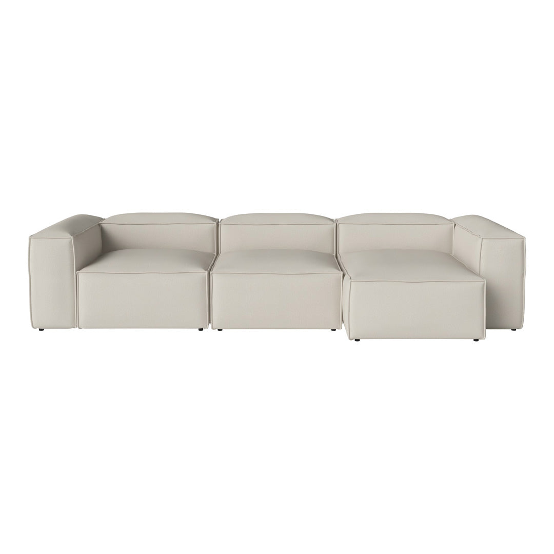 Modern beige sectional sofa with clean lines and a minimalist design, perfect for contemporary living spaces.