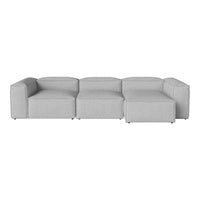 Modern gray sectional sofa with clean lines and a minimalist design, featuring a soft, textured fabric finish.