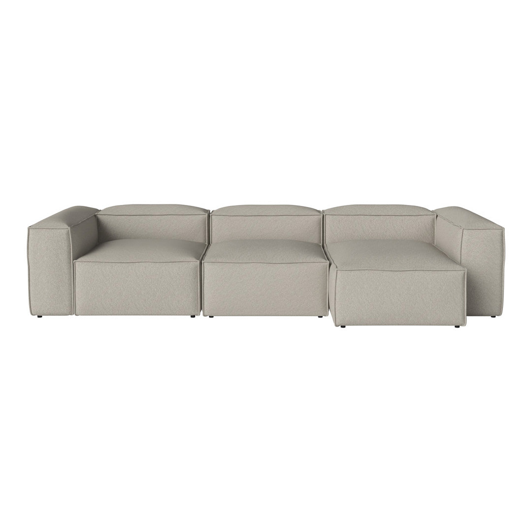Contemporary modular sofa in a soft light gray fabric with clean lines and minimalistic design.