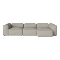 Contemporary modular sofa in a soft light gray fabric with clean lines and minimalistic design.