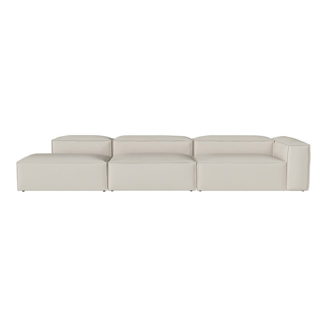 Minimalist modular sofa in soft beige fabric, featuring clean lines and a contemporary design. Perfect for modern spaces.