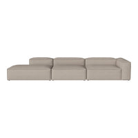 Stylish modular sectional sofa in a soft beige color with smooth, minimalist design and no visible patterns.
