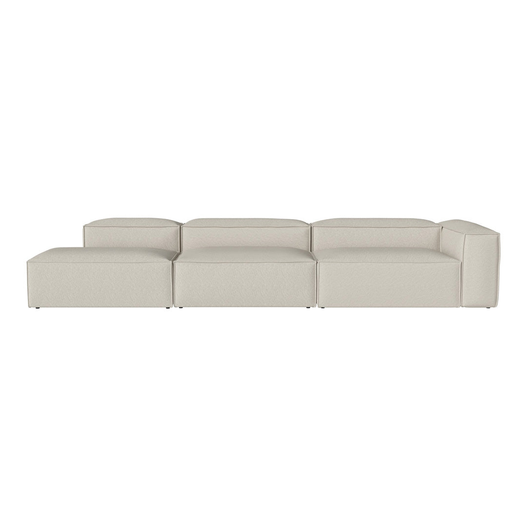 Beige modular sofa with a smooth, minimalist design and clean lines, perfect for modern living spaces.