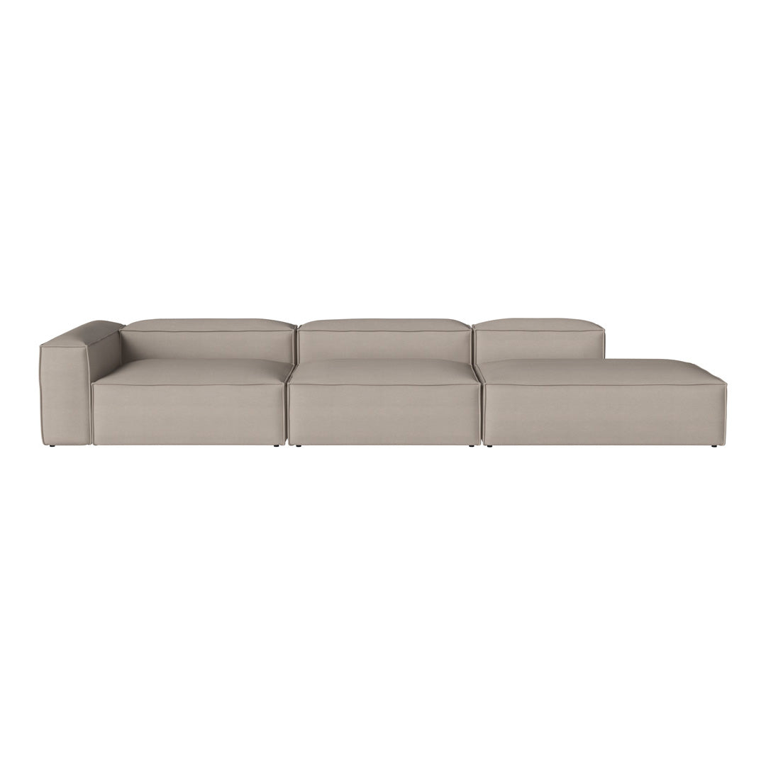 Neutral beige sectional sofa with a sleek, modern design and smooth, solid fabric upholstery.