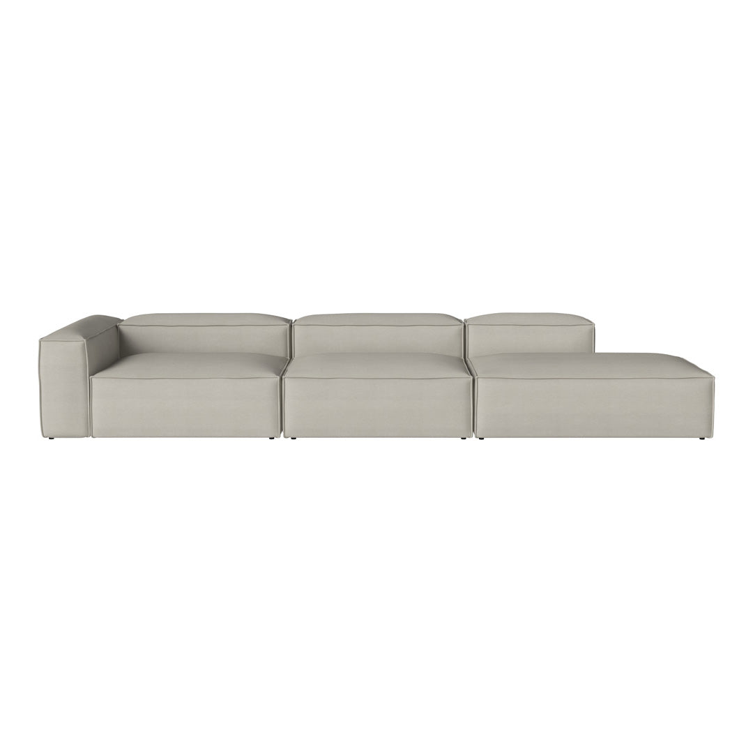 Soft grey sectional sofa with minimalist design and smooth, modern upholstery, perfect for contemporary living spaces.