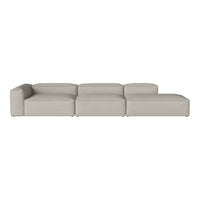 Soft grey sectional sofa with minimalist design and smooth, modern upholstery, perfect for contemporary living spaces.