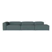 Modern teal modular sofa with a clean, minimalist design and solid color upholstery for versatile decor.