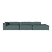 Stylish sectional sofa in a deep teal color with a modern, minimalist design and smooth, tailored upholstery.