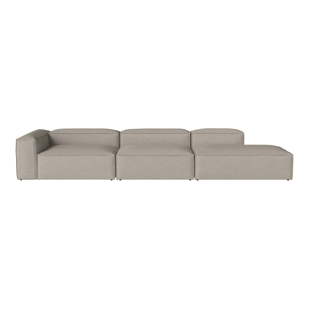 Stylish modular sectional sofa in a soft beige fabric with a minimalistic design and clean lines.