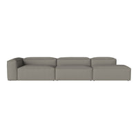 Modern sectional sofa in soft gray fabric with a sleek, minimalist design and no visible patterns.