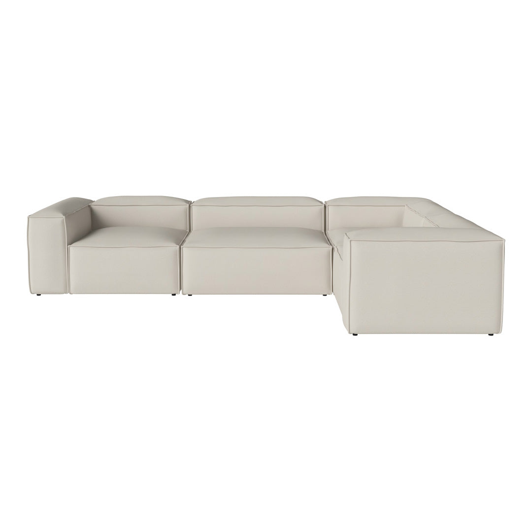 Modern beige sectional sofa with seamless design and soft texture, perfect for contemporary living spaces.