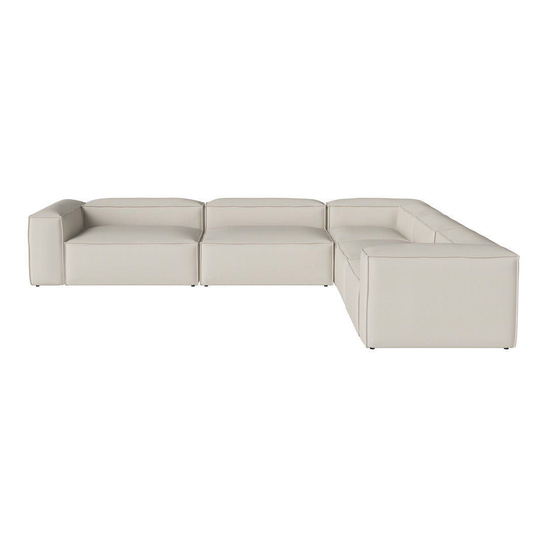 "Light beige sectional sofa with smooth, modern lines and a minimalist design."