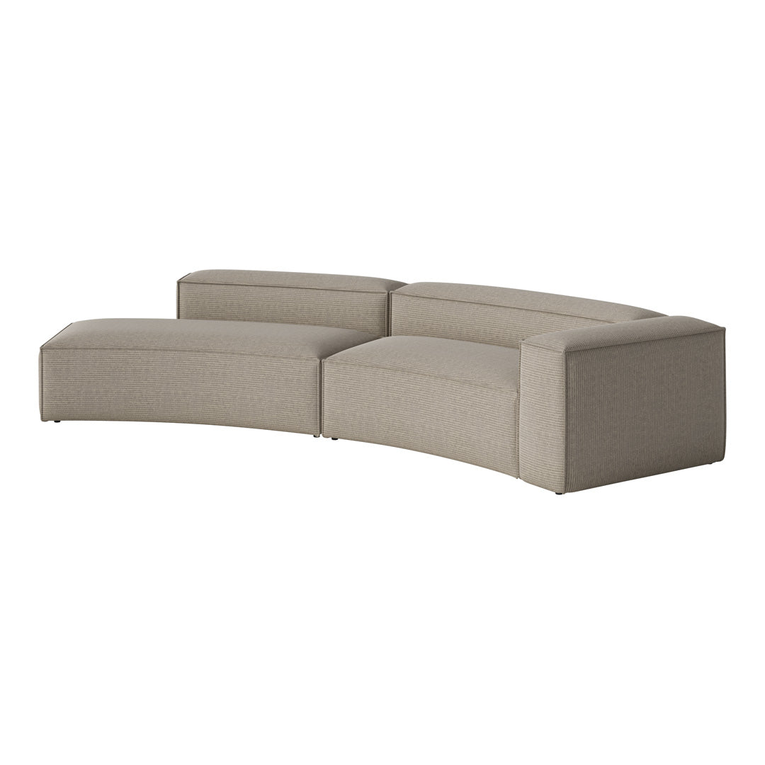 Curved sectional sofa in soft beige with a subtle ribbed texture, blending comfort and modern aesthetics.
