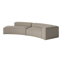 Curved sectional sofa in soft beige with a subtle ribbed texture, blending comfort and modern aesthetics.