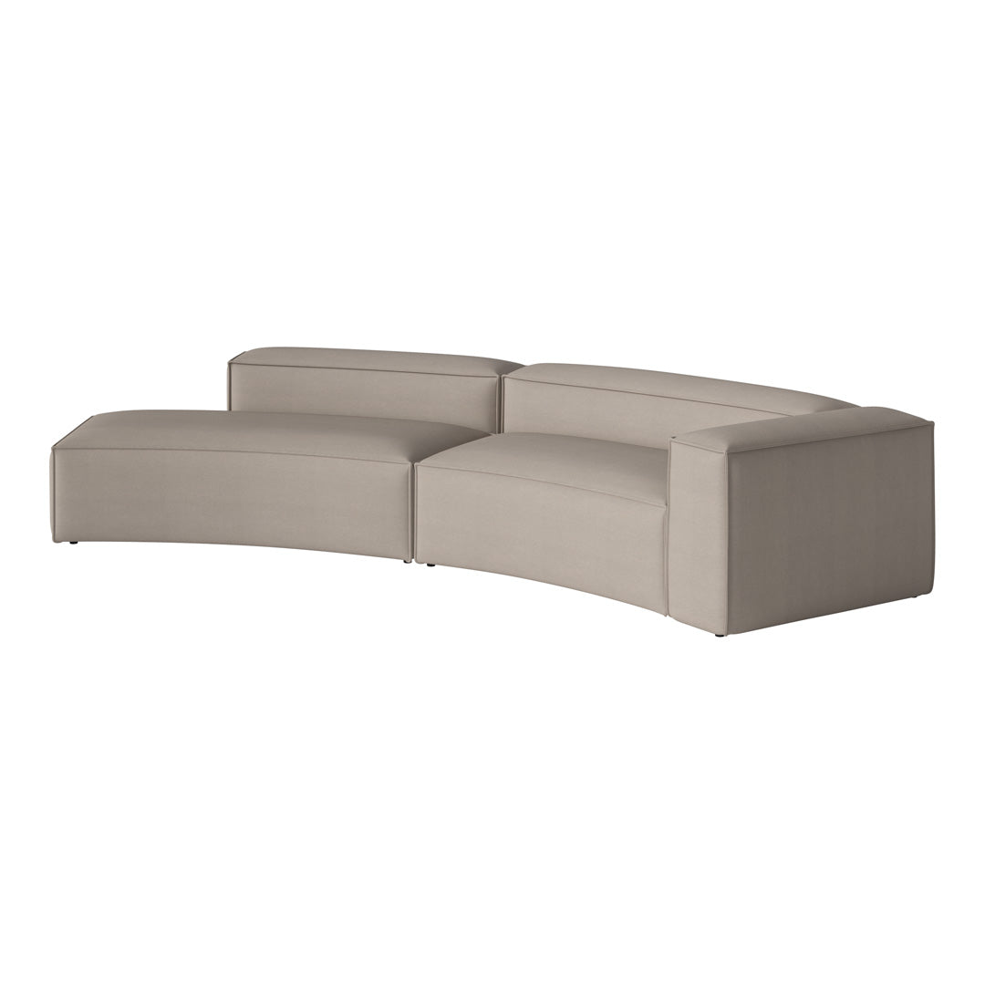 Beige curved sectional sofa with sleek, minimalist design and smooth fabric finish. Ideal for modern interiors.