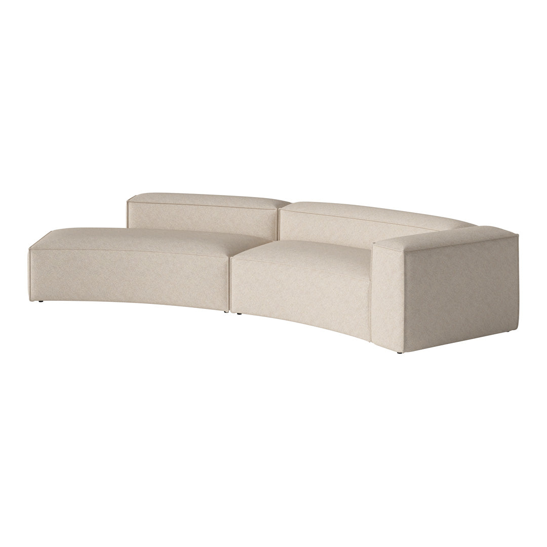 Curved sofa in soft beige fabric with a subtle textured pattern, perfect for modern living spaces.