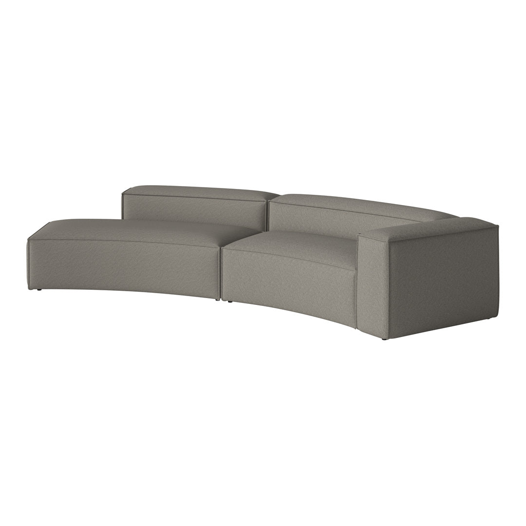 Curved light gray sectional sofa with a textured fabric, featuring clean lines and minimalistic design.
