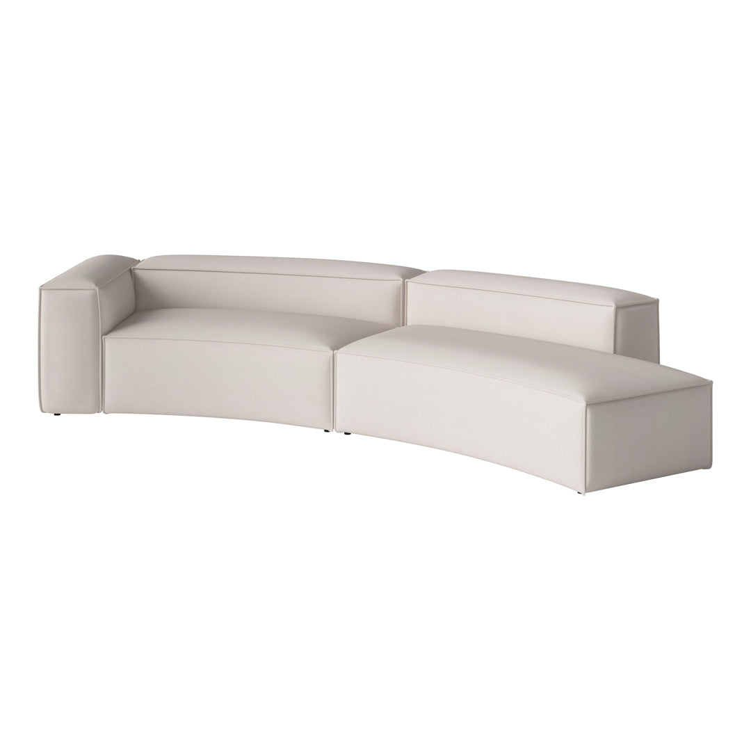 Curved sectional sofa in soft beige upholstery with a smooth, minimalist design and subtle texture.
