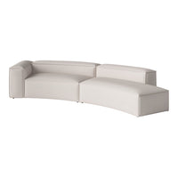 Curved sectional sofa in soft beige upholstery with a smooth, minimalist design and subtle texture.