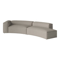 Stylish curved sofa in soft gray fabric with minimalistic design and smooth texture, perfect for modern interiors.