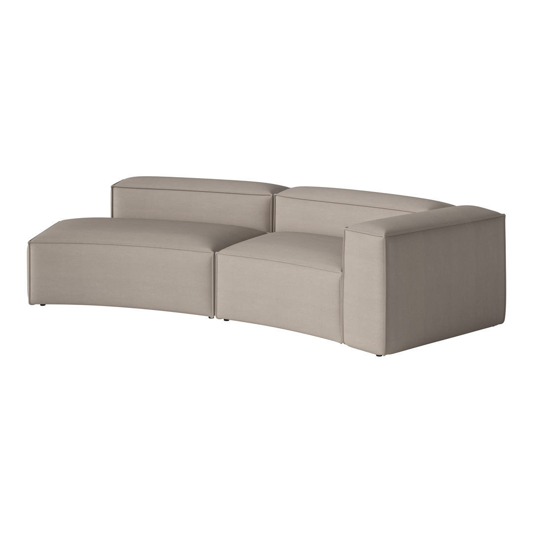 Sleek beige sectional sofa with smooth, modern lines and a minimalist design perfect for any contemporary space.