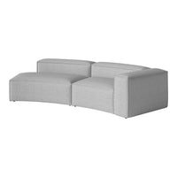 Curved gray sofa with a textured fabric, featuring a minimalist design and smooth lines for a modern look.