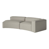 Curved sectional sofa in soft gray fabric with a minimalist texture, perfect for modern living spaces.