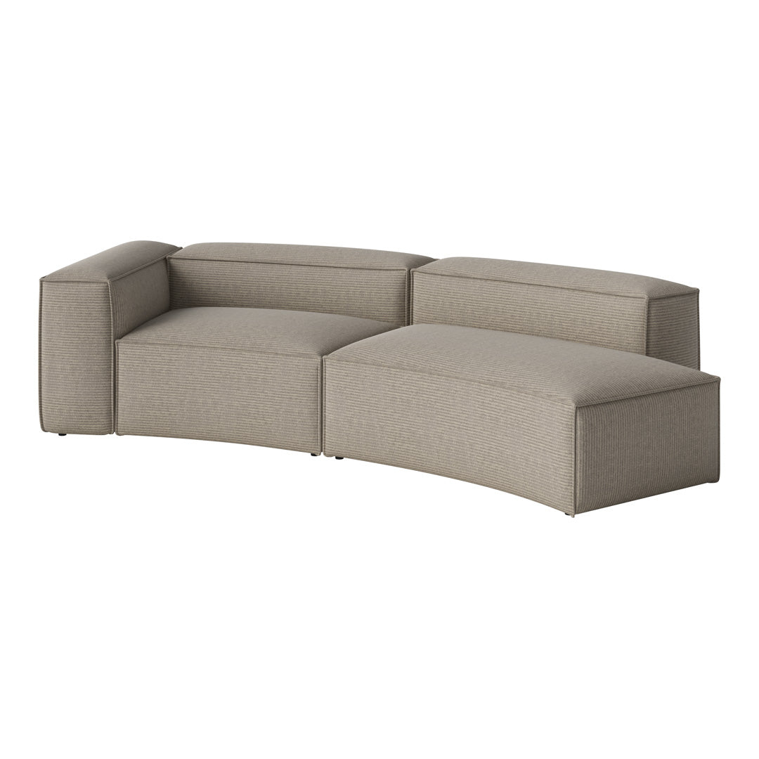 Curved sectional sofa in soft beige fabric with subtle ribbed texture, perfect for modern living spaces.