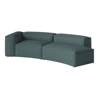 Modern curved sofa in a rich teal color with a textured fabric finish. Perfect for contemporary living spaces.