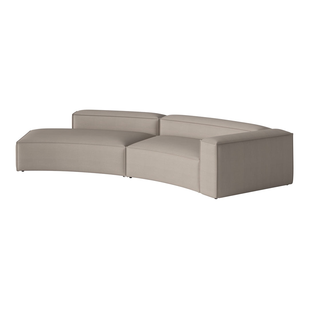 Curved modern sofa in soft beige fabric, featuring a minimalist design with smooth, complementary lines.