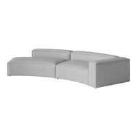 Curved gray sofa with a minimalistic design and subtle texture, ideal for modern living spaces.