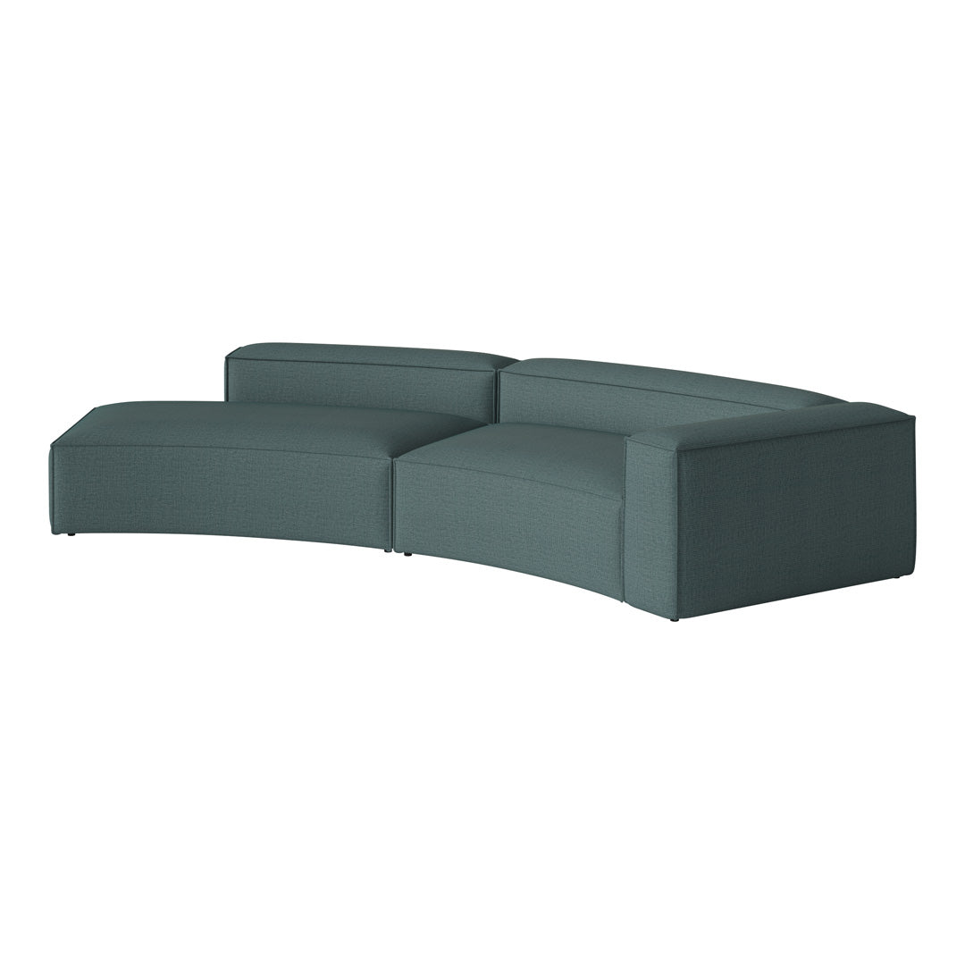 Curved teal sofa with a smooth, textured fabric and minimalist design, enhancing modern living spaces.