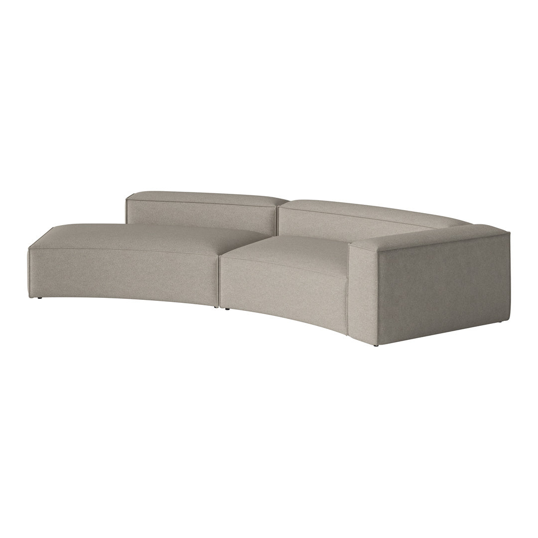 Curved sectional sofa in soft beige fabric with a minimalist design and smooth lines, perfect for modern decor.
