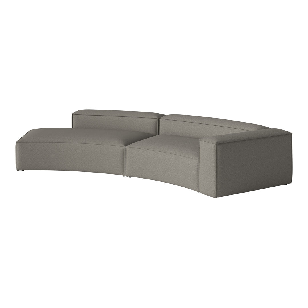 Curved sectional sofa in subtle gray fabric with a clean, modern silhouette and soft texture. Ideal for contemporary spaces.